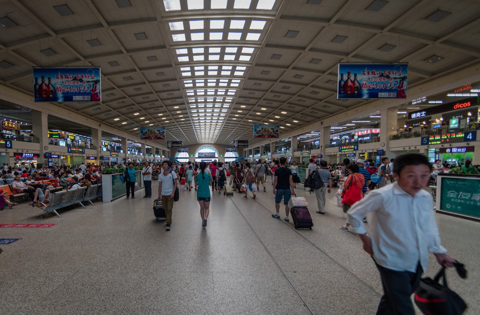 Best apps for China travel on a smartphone beside a railway ticket